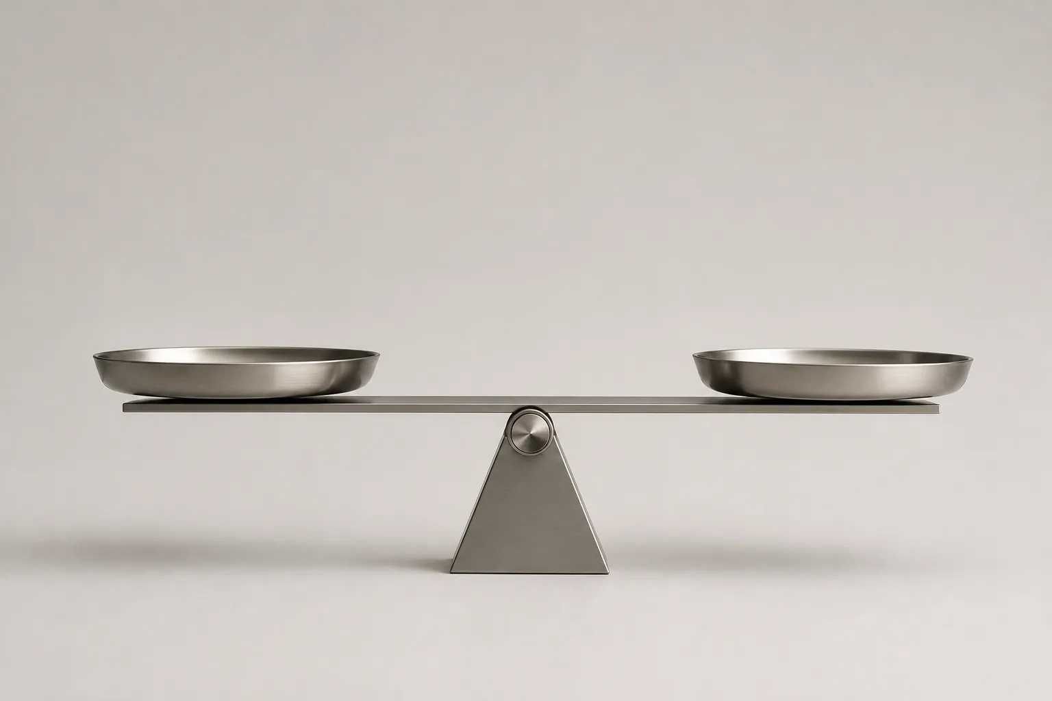 A balance scale with two empty pans, level